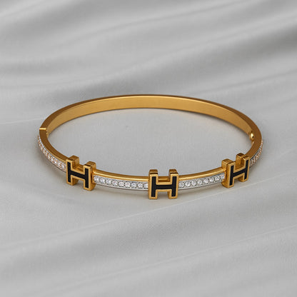 Luxury Gold-Plated “H” Designer Bangle with Black Enamel & Micro-Stone Detailing