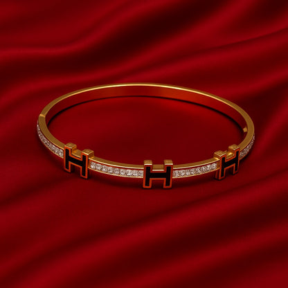 Luxury Gold-Plated “H” Designer Bangle with Black Enamel & Micro-Stone Detailing